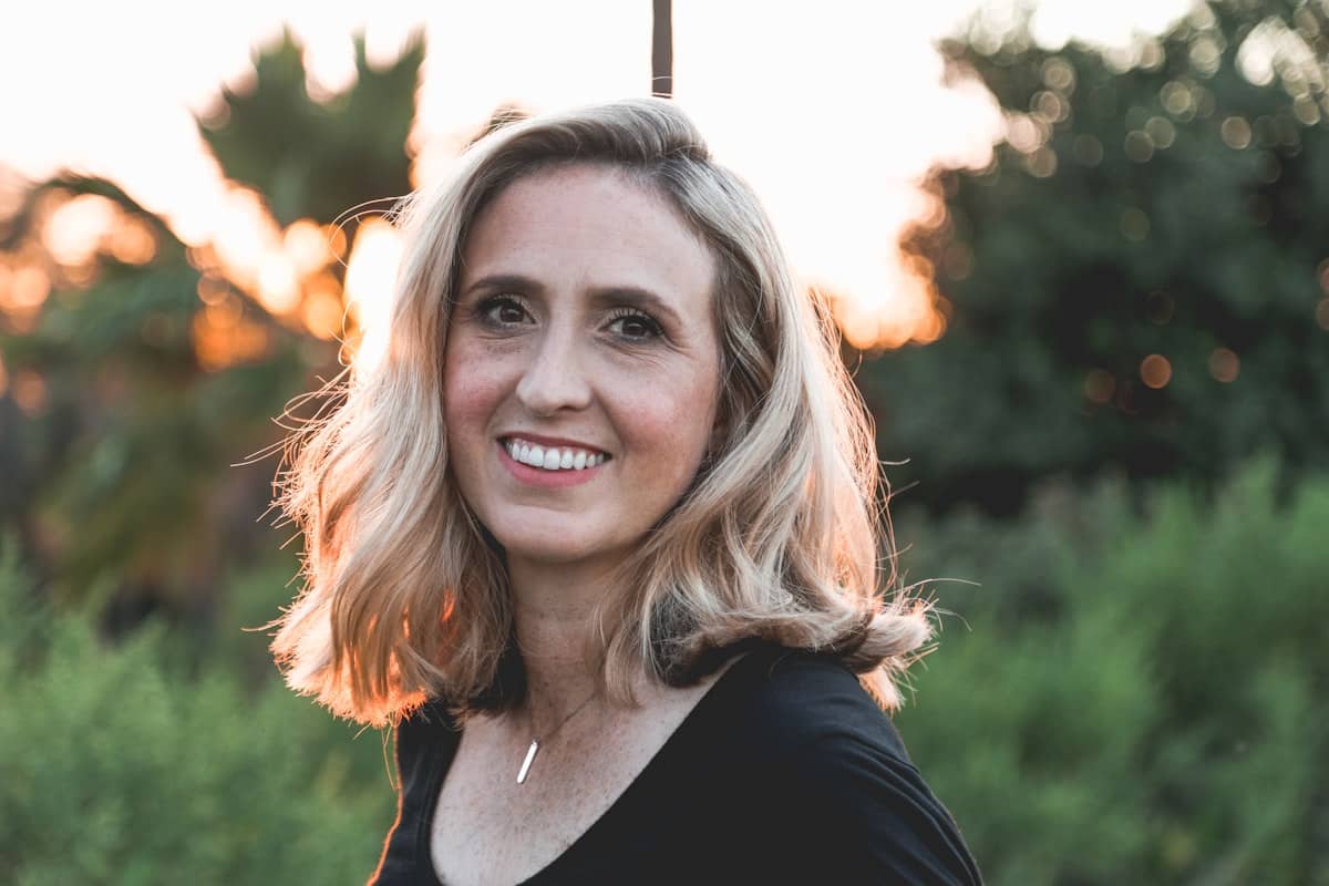 Woman smiling naturally in warm evening light